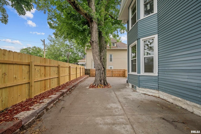 1312 Ripley St, Davenport, IA 52803 - fenced backyard with a patio area
