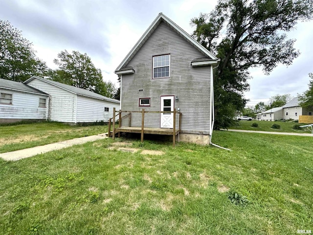 116 W 13th St, Kewanee, IL 61443 - rear view of property with a lawn and a wooden deck