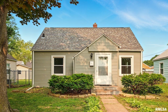 2121 4th St, Moline, IL 61265 - view of front of house with a chimney and roof with shingles