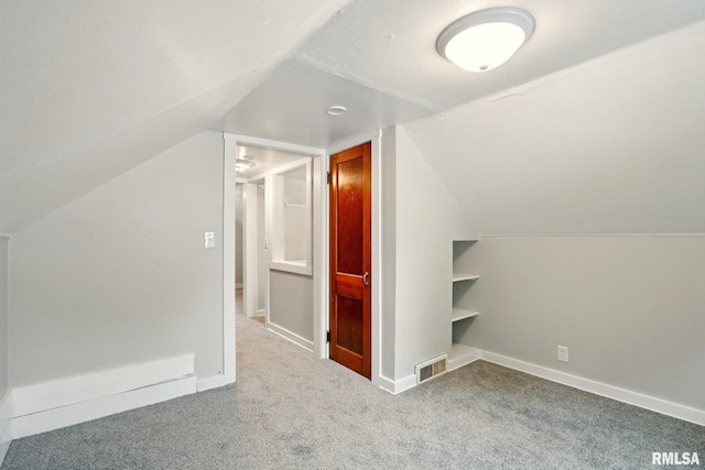 2121 4th St, Moline, IL 61265 - bonus room featuring carpet flooring, vaulted ceiling, and baseboards