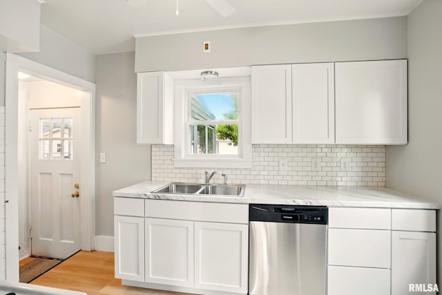 2121 4th St, Moline, IL 61265 - kitchen with dishwasher, a sink, light wood-style flooring, white cabinetry, and crown molding