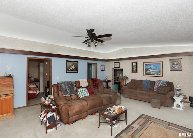 2015 N Zenith Ave, Davenport, IA 52804 - living room featuring light colored carpet, ceiling fan, vaulted ceiling, and a textured ceiling
