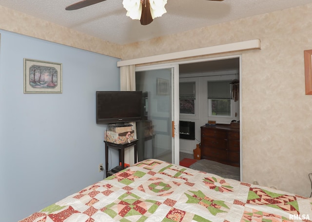 2015 N Zenith Ave, Davenport, IA 52804 - bedroom with a textured ceiling and ceiling fan