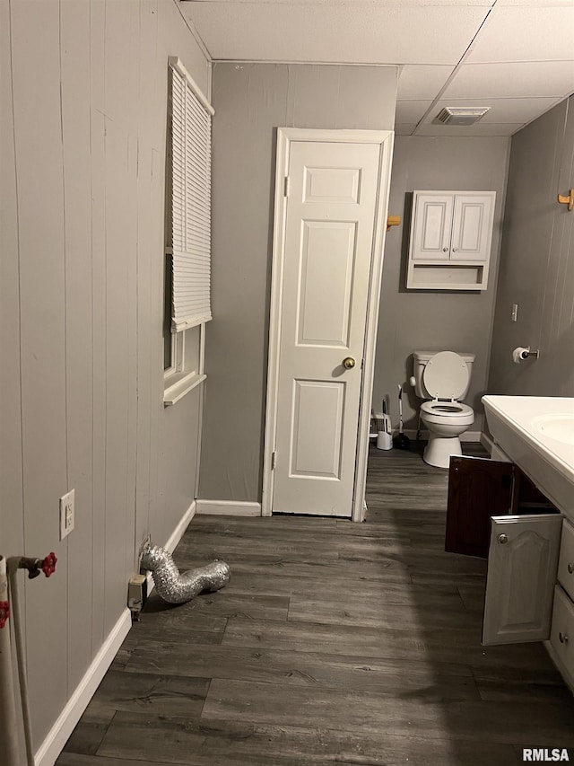 105-109 NE 5th Ave, Aledo, IL 61231 - bathroom featuring baseboards, wood finished floors, vanity, and toilet
