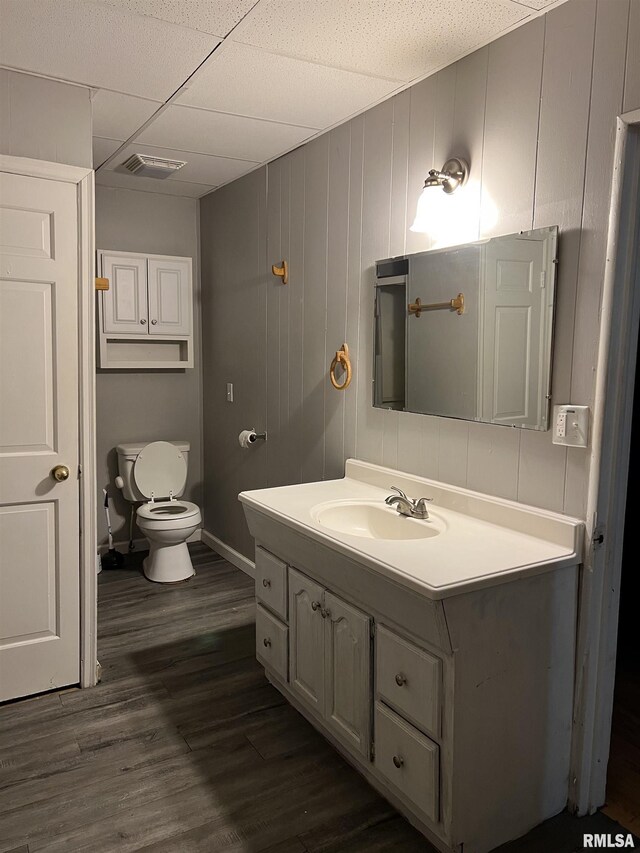 105-109 NE 5th Ave, Aledo, IL 61231 - half bath with vanity, wood finished floors, toilet, and baseboards