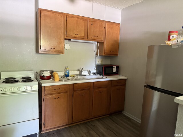 105-109 NE 5th Ave, Aledo, IL 61231 - kitchen featuring freestanding refrigerator, white electric range, black microwave, and light countertops