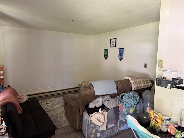 105-109 NE 5th Ave, Aledo, IL 61231 - living area featuring wood finished floors and a baseboard radiator