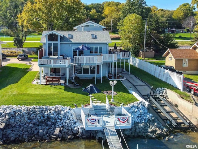 22867 Great River Rd, Le Claire, IA 52753 - back of property with stairway, a deck, a patio, and a shingled roof