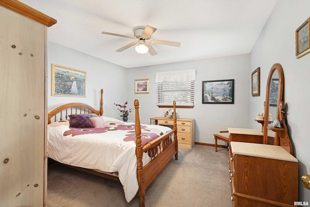 22867 Great River Rd, Le Claire, IA 52753 - bedroom featuring light carpet, a ceiling fan, and baseboards