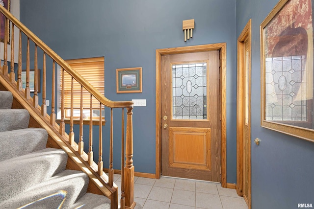 22867 Great River Rd, Le Claire, IA 52753 - tiled foyer with baseboards and stairway