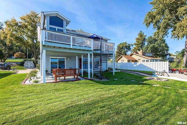 22867 Great River Rd, Le Claire, IA 52753 - rear view of house featuring a deck, a patio area, and stairs