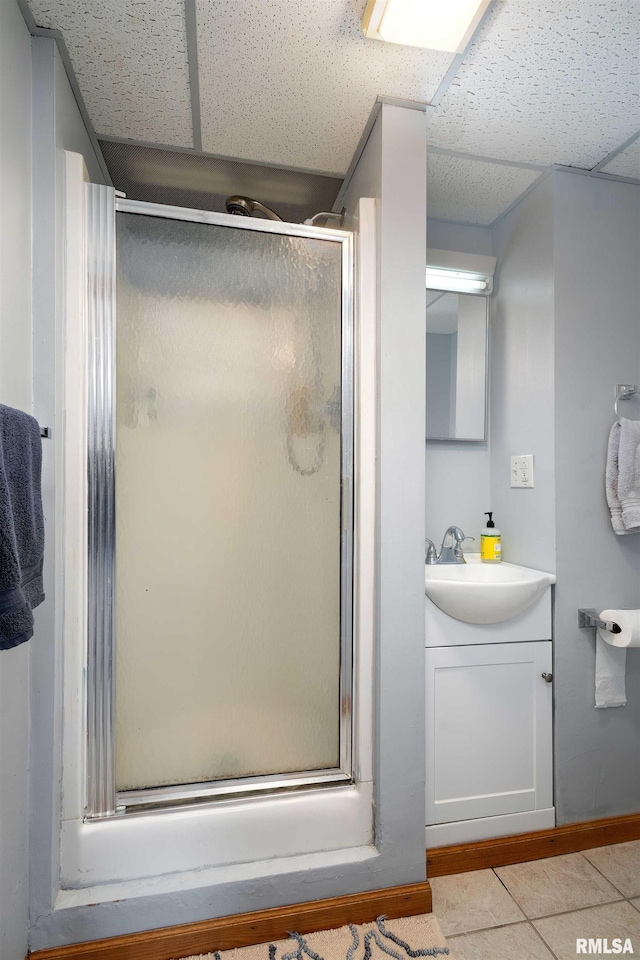 22867 Great River Rd, Le Claire, IA 52753 - bathroom with vanity, a stall shower, and a paneled ceiling