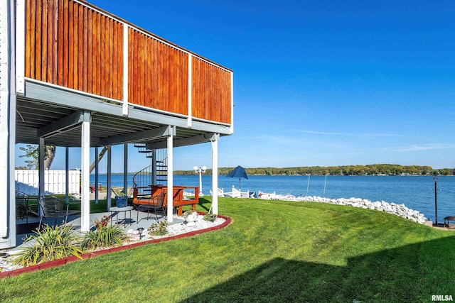 22867 Great River Rd, Le Claire, IA 52753 - view of grassy yard with a water view and a patio