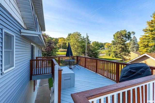 22867 Great River Rd, Le Claire, IA 52753 - wooden deck featuring outdoor dining area