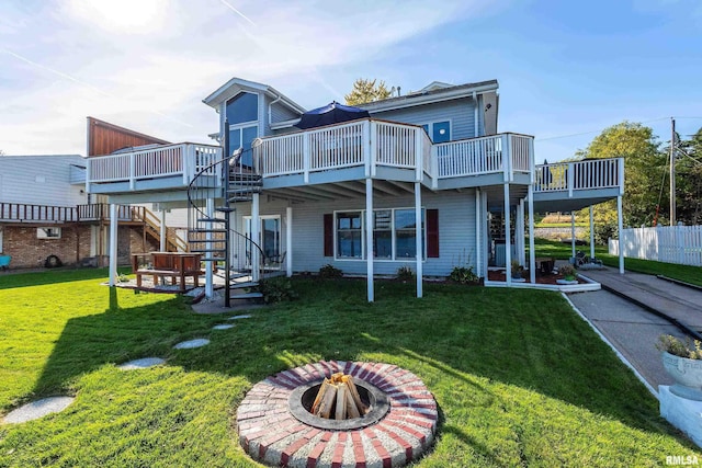 22867 Great River Rd, Le Claire, IA 52753 - rear view of property featuring a deck, stairs, and an outdoor fire pit
