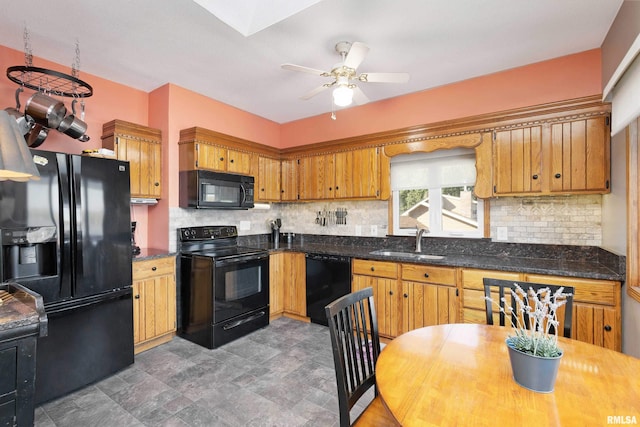 22867 Great River Rd, Le Claire, IA 52753 - kitchen with black appliances, a sink, decorative backsplash, and ceiling fan