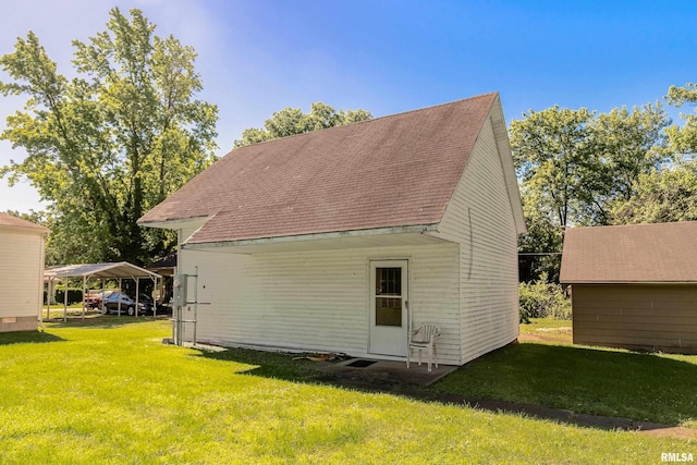 402 S Meadow St, Royalton, IL 62983 - view of home's exterior with a detached carport, a lawn, and roof with shingles