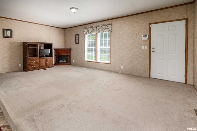 402 S Meadow St, Royalton, IL 62983 - unfurnished living room featuring ornamental molding, carpet, and a fireplace with raised hearth