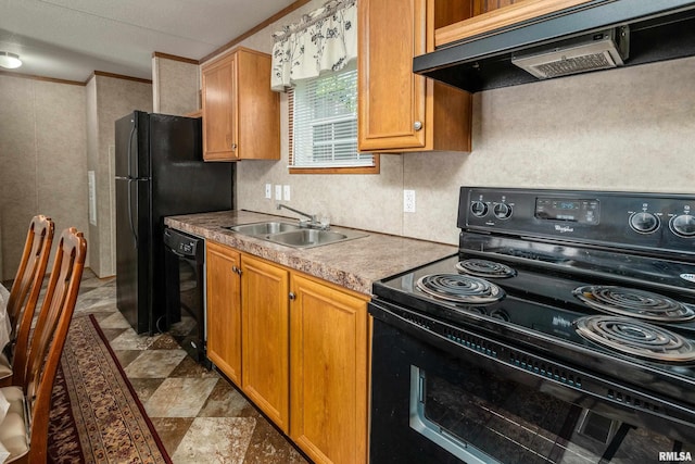 402 S Meadow St, Royalton, IL 62983 - kitchen featuring black appliances, under cabinet range hood, a sink, and brown cabinetry