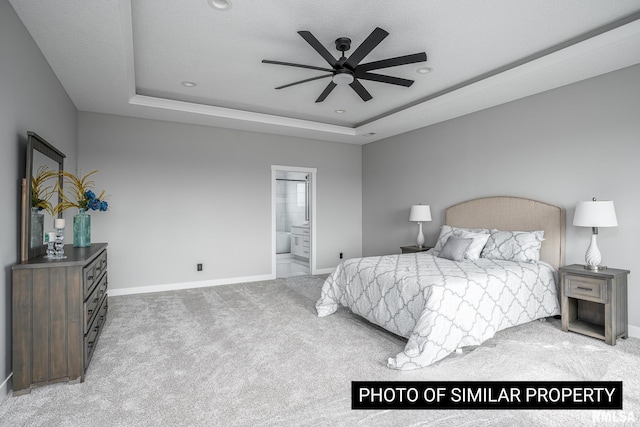 1816 E 59th Ct, Davenport, IA 52807 - carpeted bedroom with a raised ceiling, baseboards, connected bathroom, recessed lighting, and a ceiling fan