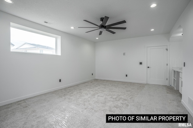 1816 E 59th Ct, Davenport, IA 52807 - carpeted empty room featuring recessed lighting, ceiling fan, baseboards, and a textured ceiling