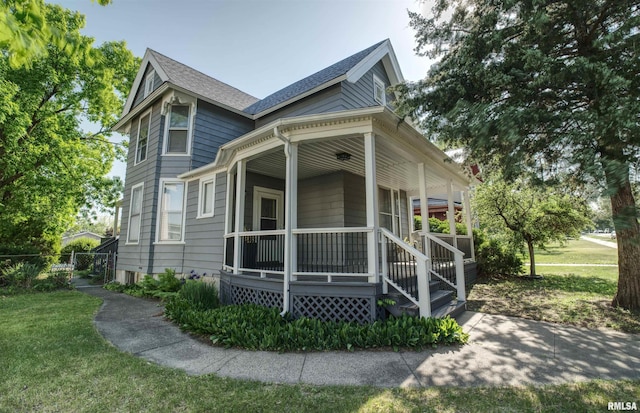 541 10th Ave S, Clinton, IA 52732 - victorian house with covered porch and roof with shingles