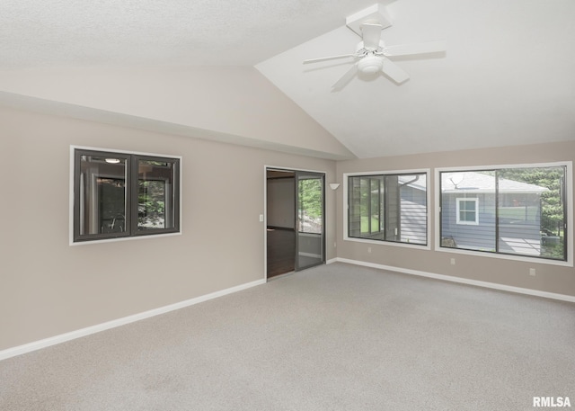 3 Wildwood Trl, Bettendorf, IA 52722 - carpeted empty room featuring vaulted ceiling, healthy amount of natural light, baseboards, and a ceiling fan