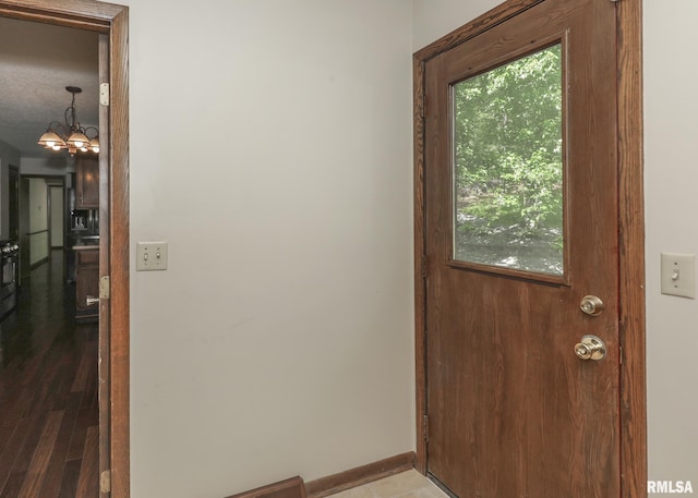 3 Wildwood Trl, Bettendorf, IA 52722 - entryway with a chandelier and baseboards