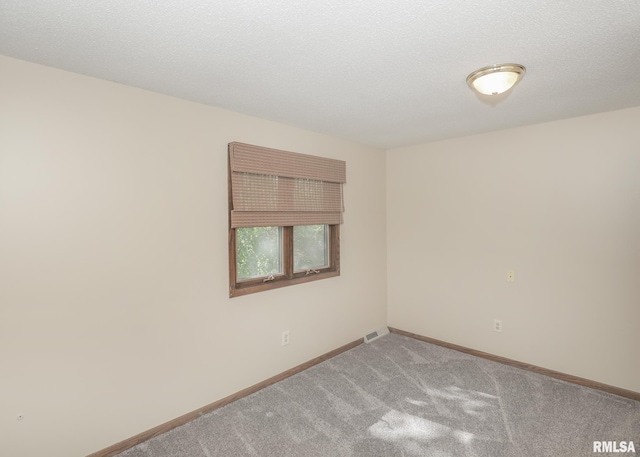 3 Wildwood Trl, Bettendorf, IA 52722 - spare room featuring carpet and baseboards