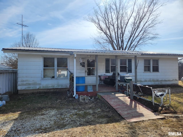 1558 N 2700th Ave, Loraine, IL 62349 - view of front facade featuring covered porch and metal roof