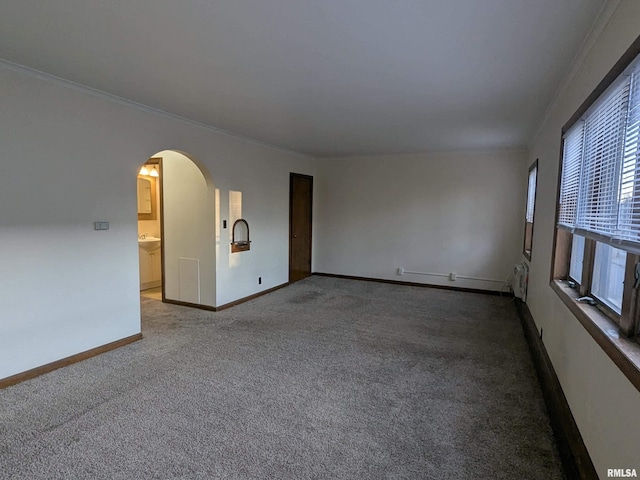 1726 9th St, Moline, IL 61265 - carpeted spare room with arched walkways, ornamental molding, and baseboards