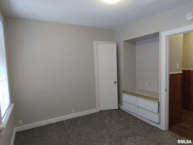 832 W 8th St, Davenport, IA 52803 - unfurnished bedroom featuring dark carpet