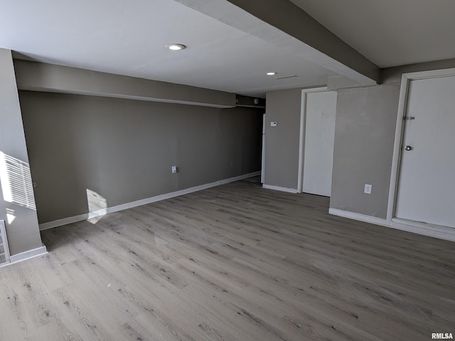 832 W 8th St, Davenport, IA 52803 - finished basement with wood finished floors, baseboards, and recessed lighting