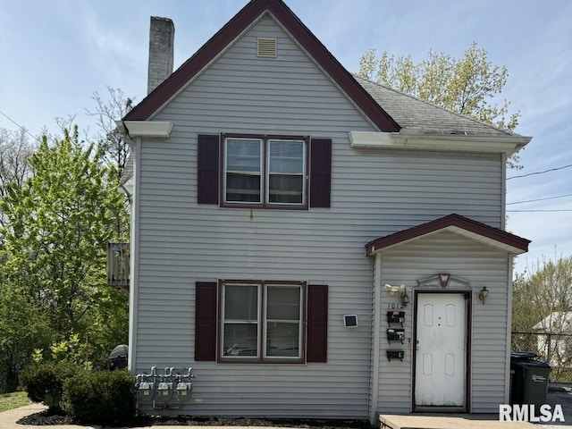 1012 Bridge Ave, Davenport, IA 52803 - traditional-style house with a chimney