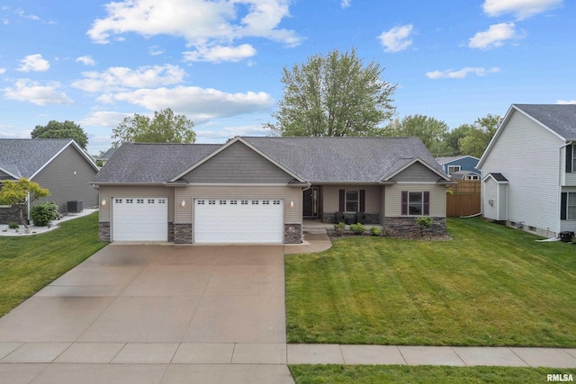510 W Pinehurst Dr, Eldridge, IA 52748 - craftsman house featuring stone siding, an attached garage, and a front lawn