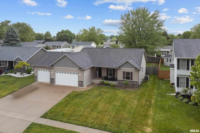 510 W Pinehurst Dr, Eldridge, IA 52748 - view of front of property with stone siding, a garage, driveway, a porch, and a residential view