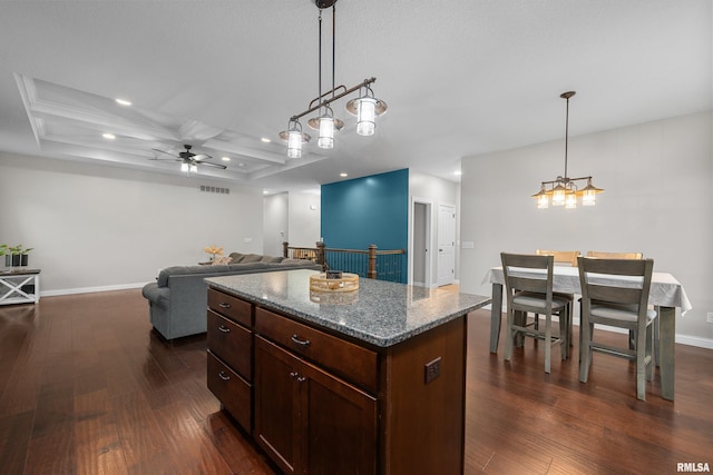 510 W Pinehurst Dr, Eldridge, IA 52748 - kitchen with coffered ceiling, dark wood finished floors, recessed lighting, ceiling fan, and a center island