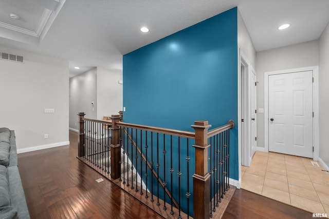 510 W Pinehurst Dr, Eldridge, IA 52748 - hall featuring an upstairs landing, wood finished floors, baseboards, recessed lighting, and ornamental molding