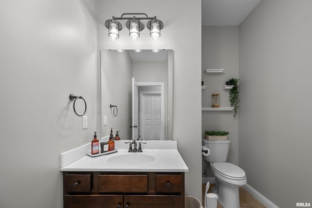 510 W Pinehurst Dr, Eldridge, IA 52748 - half bathroom with toilet, vanity, tile patterned floors, and baseboards