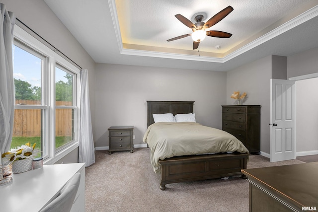 510 W Pinehurst Dr, Eldridge, IA 52748 - bedroom featuring light colored carpet, a raised ceiling, baseboards, and ceiling fan