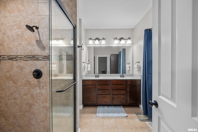 510 W Pinehurst Dr, Eldridge, IA 52748 - bathroom with a stall shower, double vanity, and tile patterned flooring
