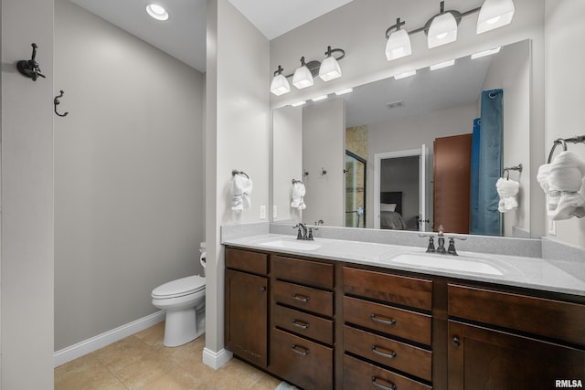 510 W Pinehurst Dr, Eldridge, IA 52748 - full bathroom featuring double vanity, a stall shower, toilet, baseboards, and tile patterned flooring