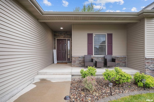 510 W Pinehurst Dr, Eldridge, IA 52748 - entrance to property featuring a porch and stone siding