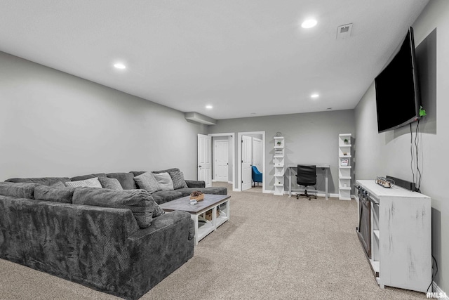 510 W Pinehurst Dr, Eldridge, IA 52748 - living room with recessed lighting, a desk, light carpet, and baseboards