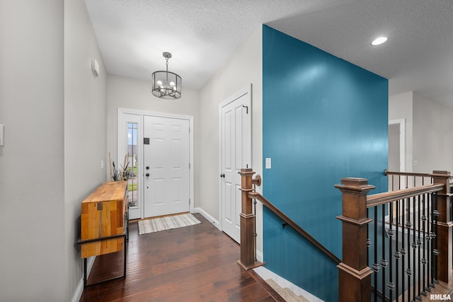 510 W Pinehurst Dr, Eldridge, IA 52748 - entryway with a chandelier, a textured ceiling, wood finished floors, baseboards, and recessed lighting