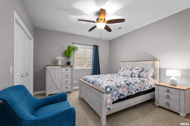 510 W Pinehurst Dr, Eldridge, IA 52748 - bedroom with light colored carpet, a closet, ceiling fan, and baseboards