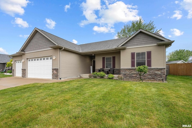 510 W Pinehurst Dr, Eldridge, IA 52748 - view of front facade featuring stone siding, an attached garage, and concrete driveway