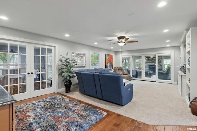 2312 Windsor Dr, Davenport, IA 52807 - living area with french doors, ceiling fan, recessed lighting, and wood finished floors