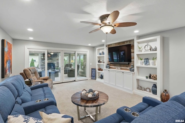 2312 Windsor Dr, Davenport, IA 52807 - living room with a ceiling fan, light colored carpet, healthy amount of natural light, built in features, and recessed lighting