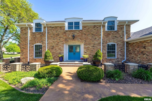 2312 Windsor Dr, Davenport, IA 52807 - view of front of house with french doors and brick siding